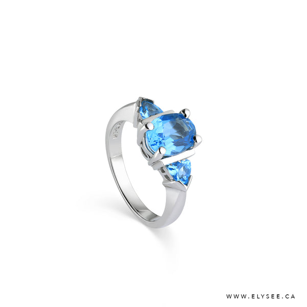 Blue Topaz Ring set in 14K White Gold, Topaz and White Gold Ring Bijouterie Élysée - Your Montreal jewellery designer.